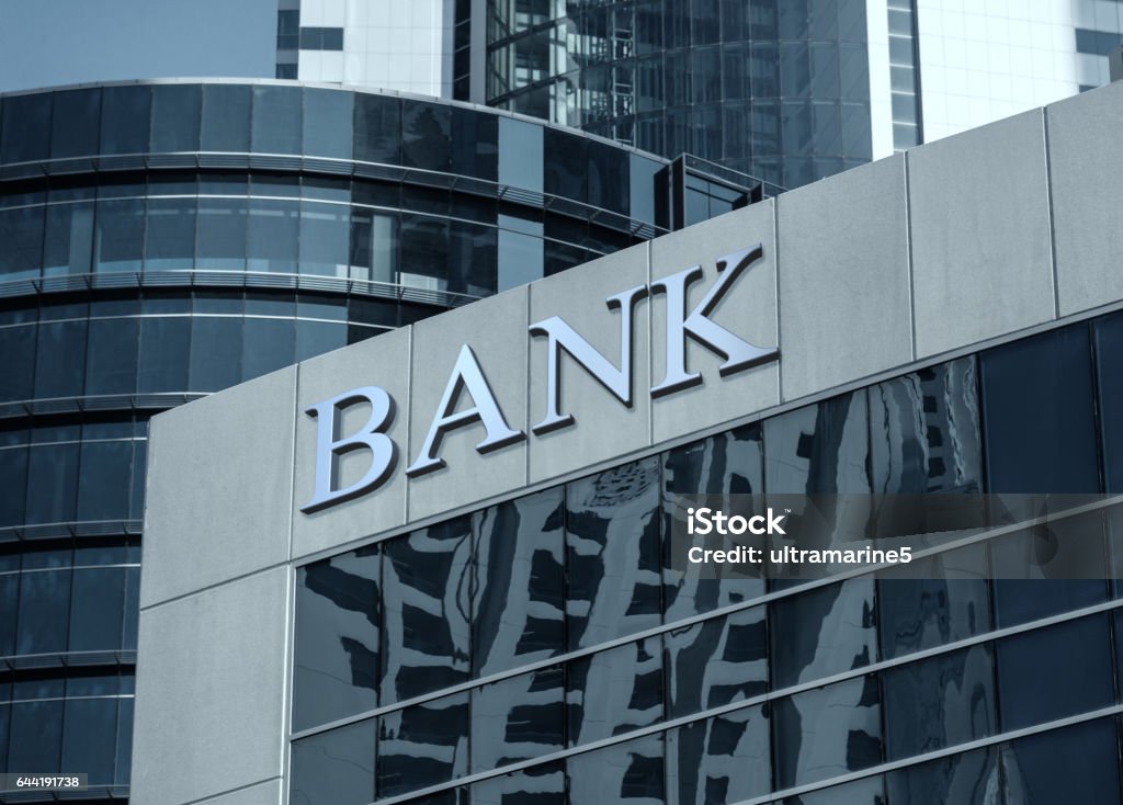 Bank sign on glass wall of business center